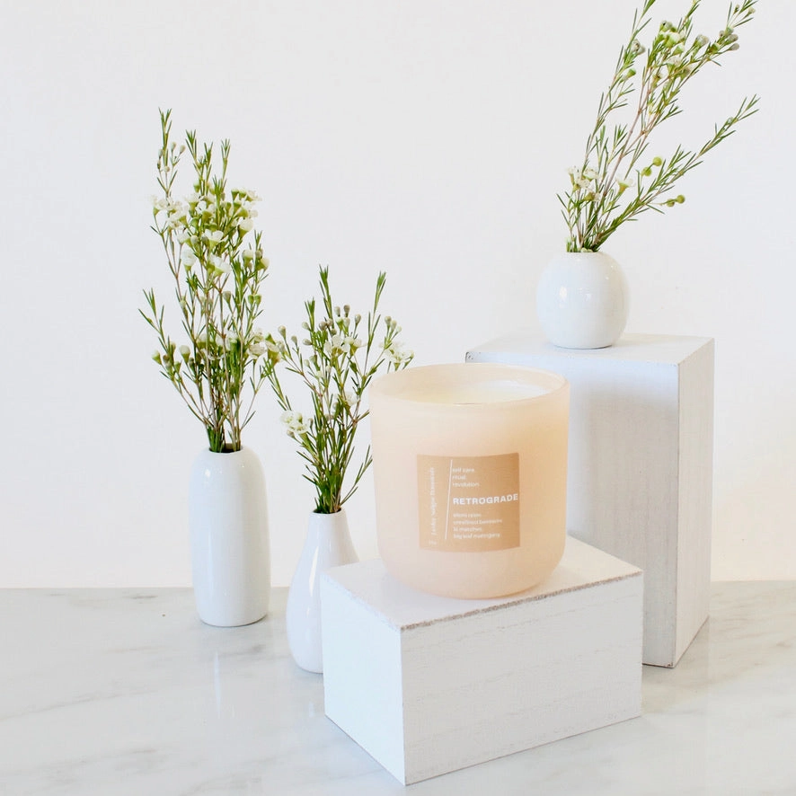 RETROGRADE Hand Poured Candle. Wood Wick. Elemi Resin. Lit Matches. Unrefined Beeswax. Big Leaf Mahogany. 14 oz. Blush Peach Matte. Large.