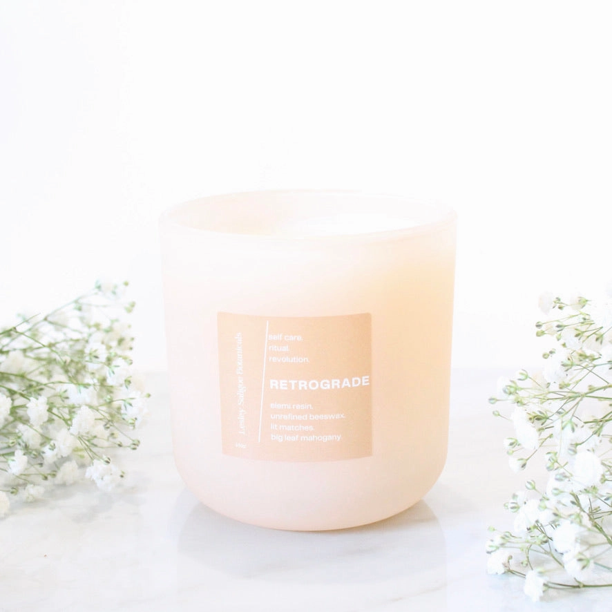 RETROGRADE Hand Poured Candle. Wood Wick. Elemi Resin. Lit Matches. Unrefined Beeswax. Big Leaf Mahogany. 14 oz. Blush Peach Matte. Large.