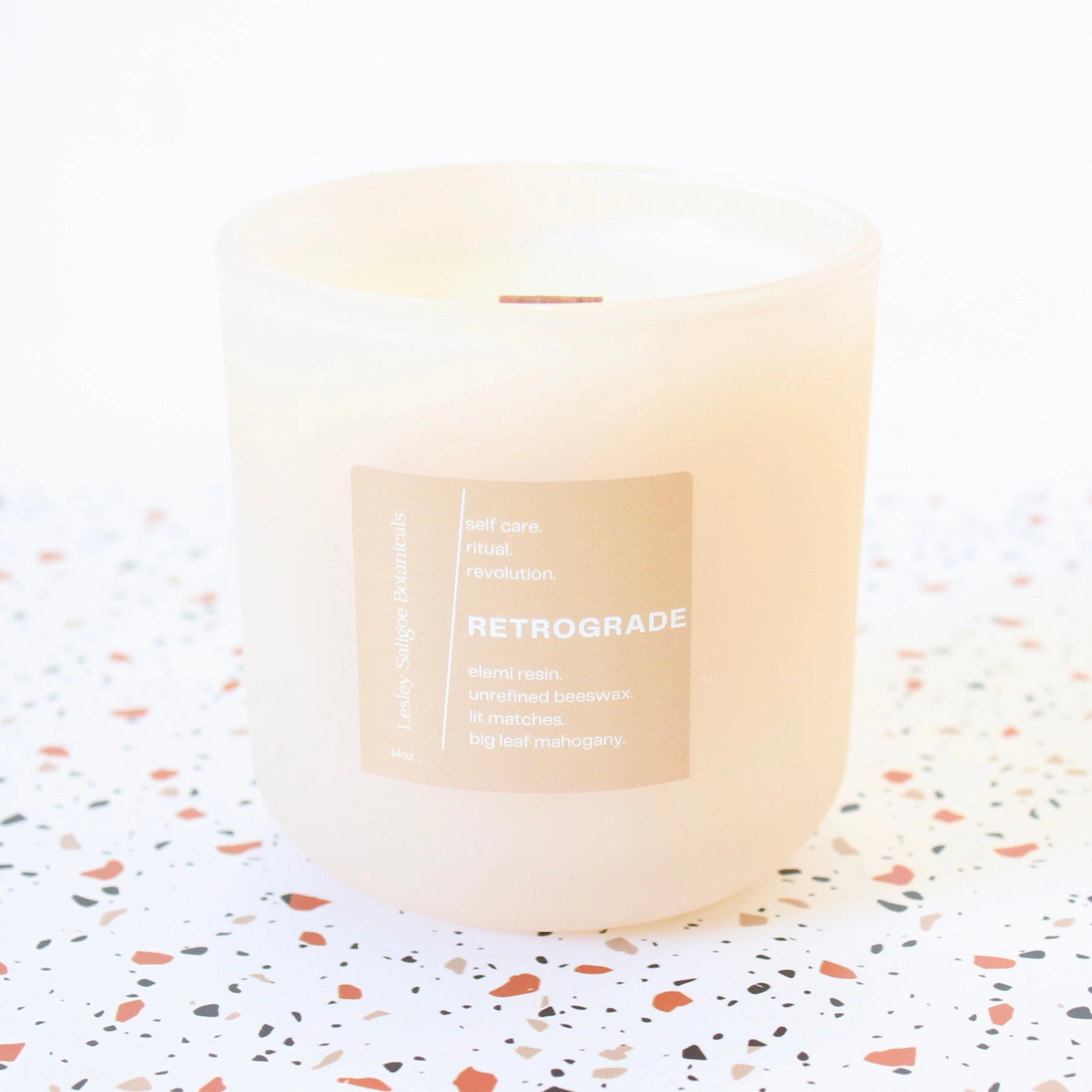 RETROGRADE Hand Poured Candle. Wood Wick. Elemi Resin. Lit Matches. Unrefined Beeswax. Big Leaf Mahogany. 14 oz. Blush Peach Matte. Large.