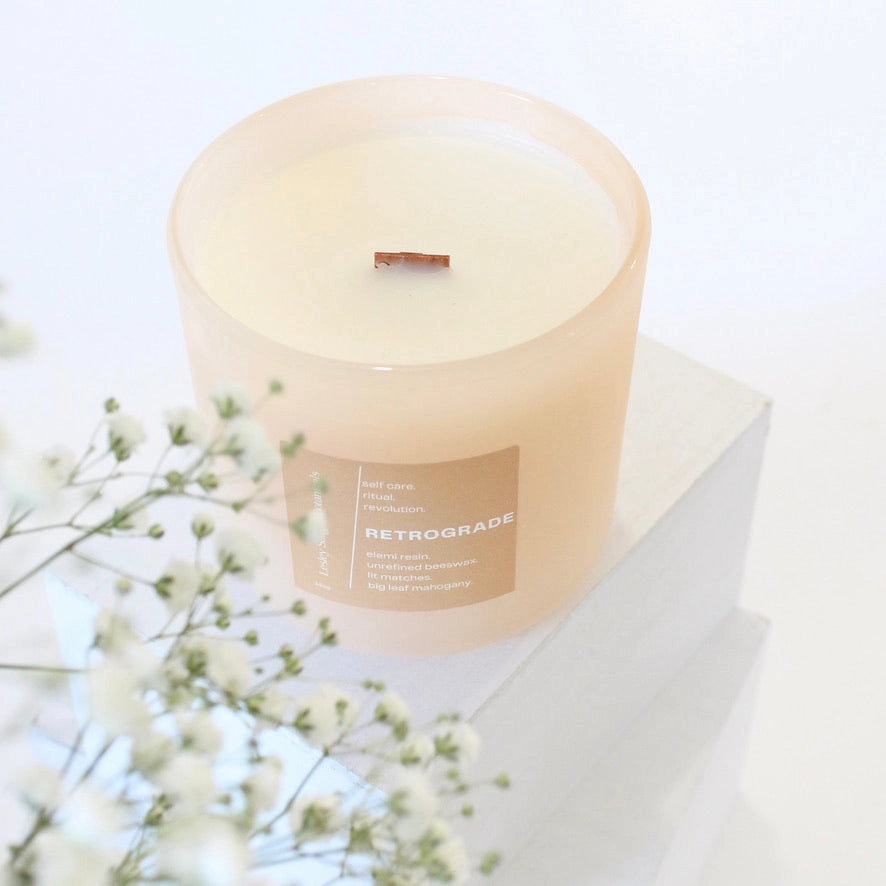 RETROGRADE Hand Poured Candle. Wood Wick. Elemi Resin. Lit Matches. Unrefined Beeswax. Big Leaf Mahogany. 14 oz. Blush Peach Matte. Large.