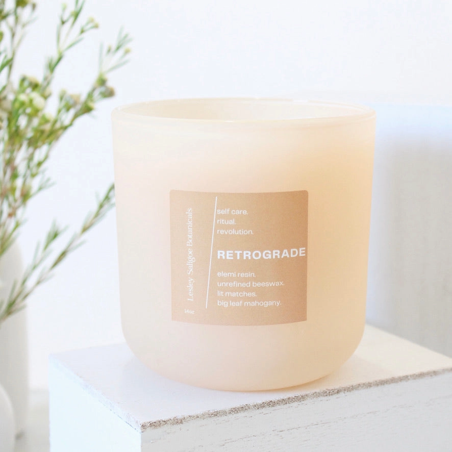 RETROGRADE Hand Poured Candle. Wood Wick. Elemi Resin. Lit Matches. Unrefined Beeswax. Big Leaf Mahogany. 14 oz. Blush Peach Matte. Large.